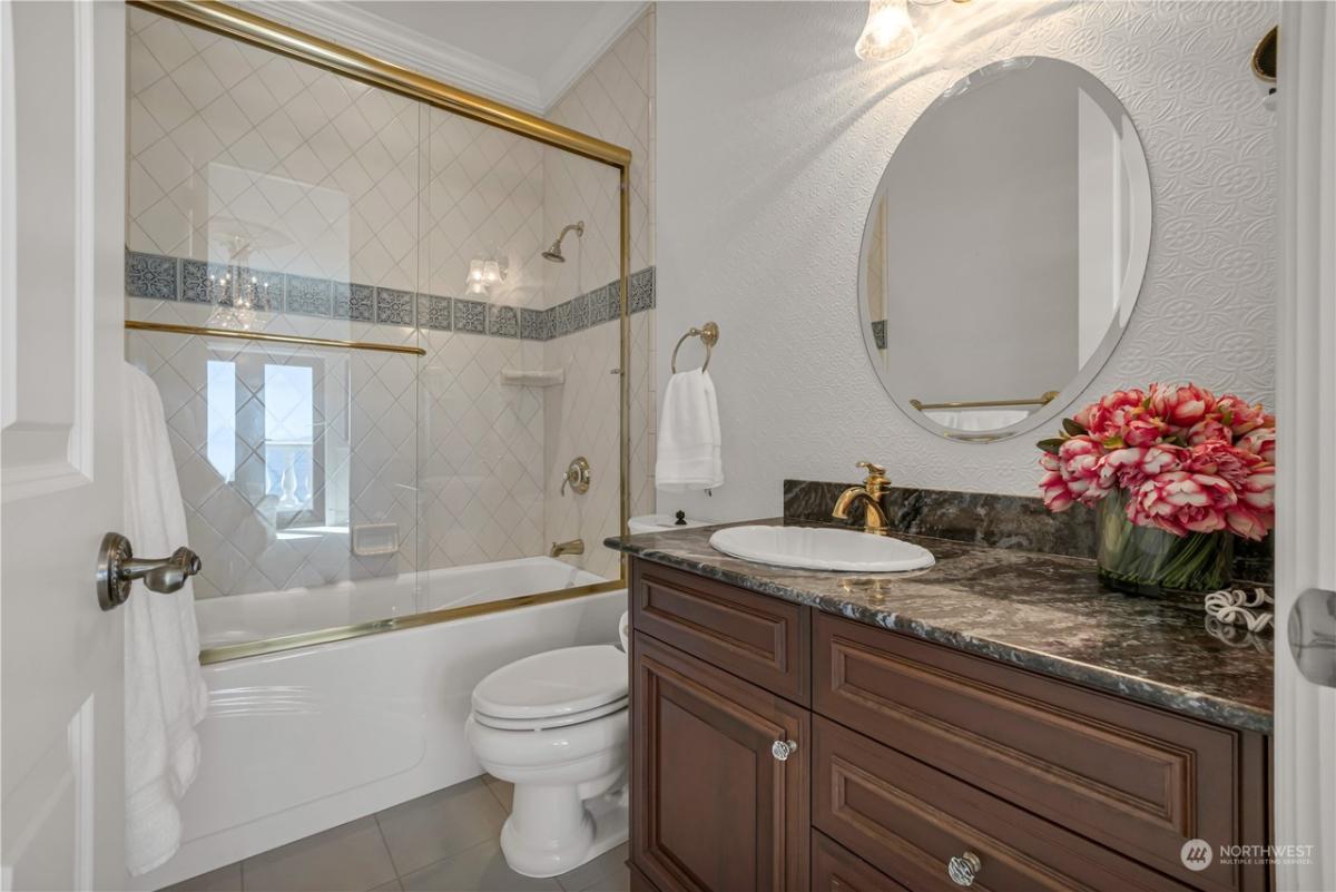 Bathroom with a sink and soaking tub.