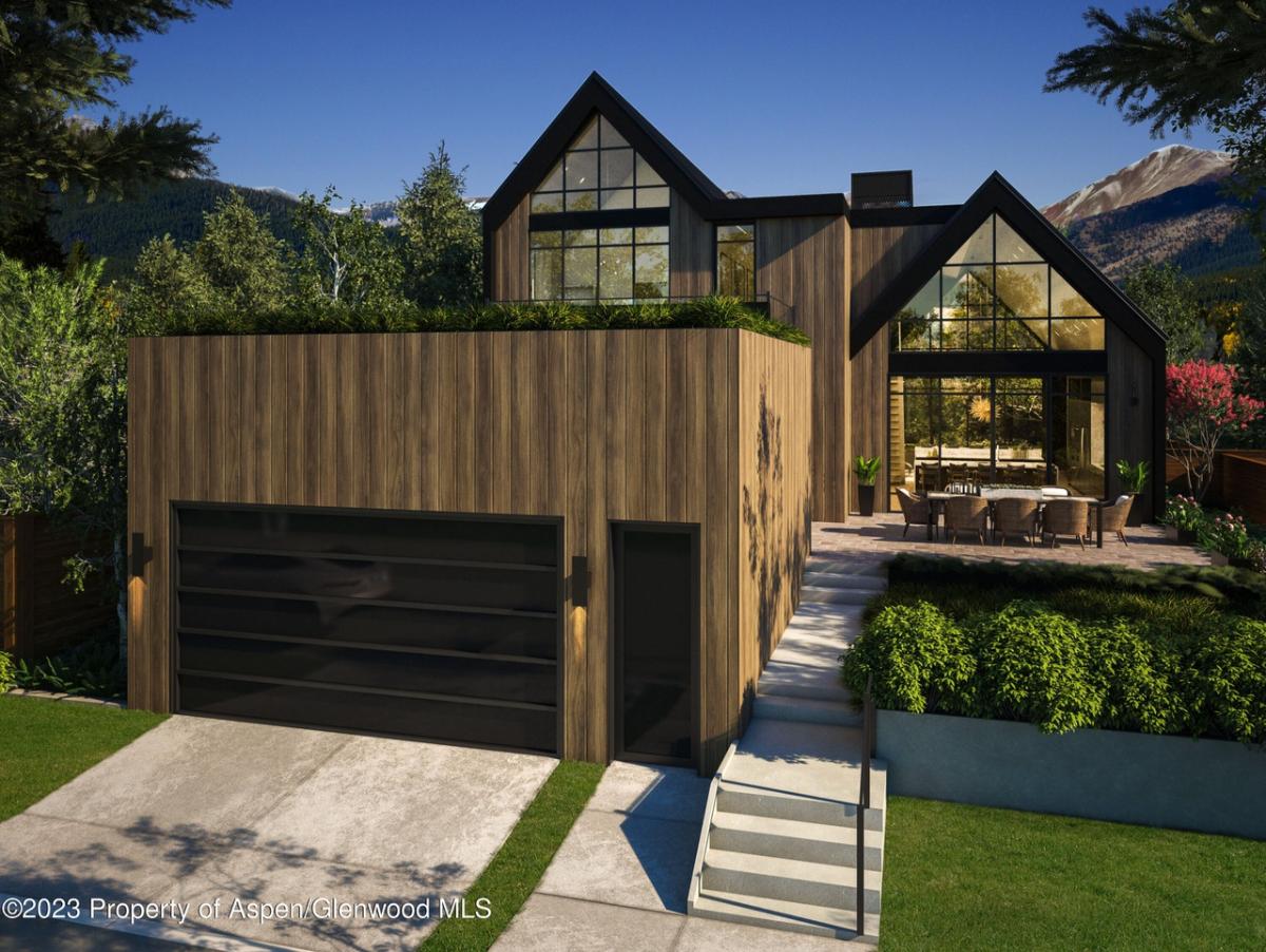 Garage with a driveway and a walkway.