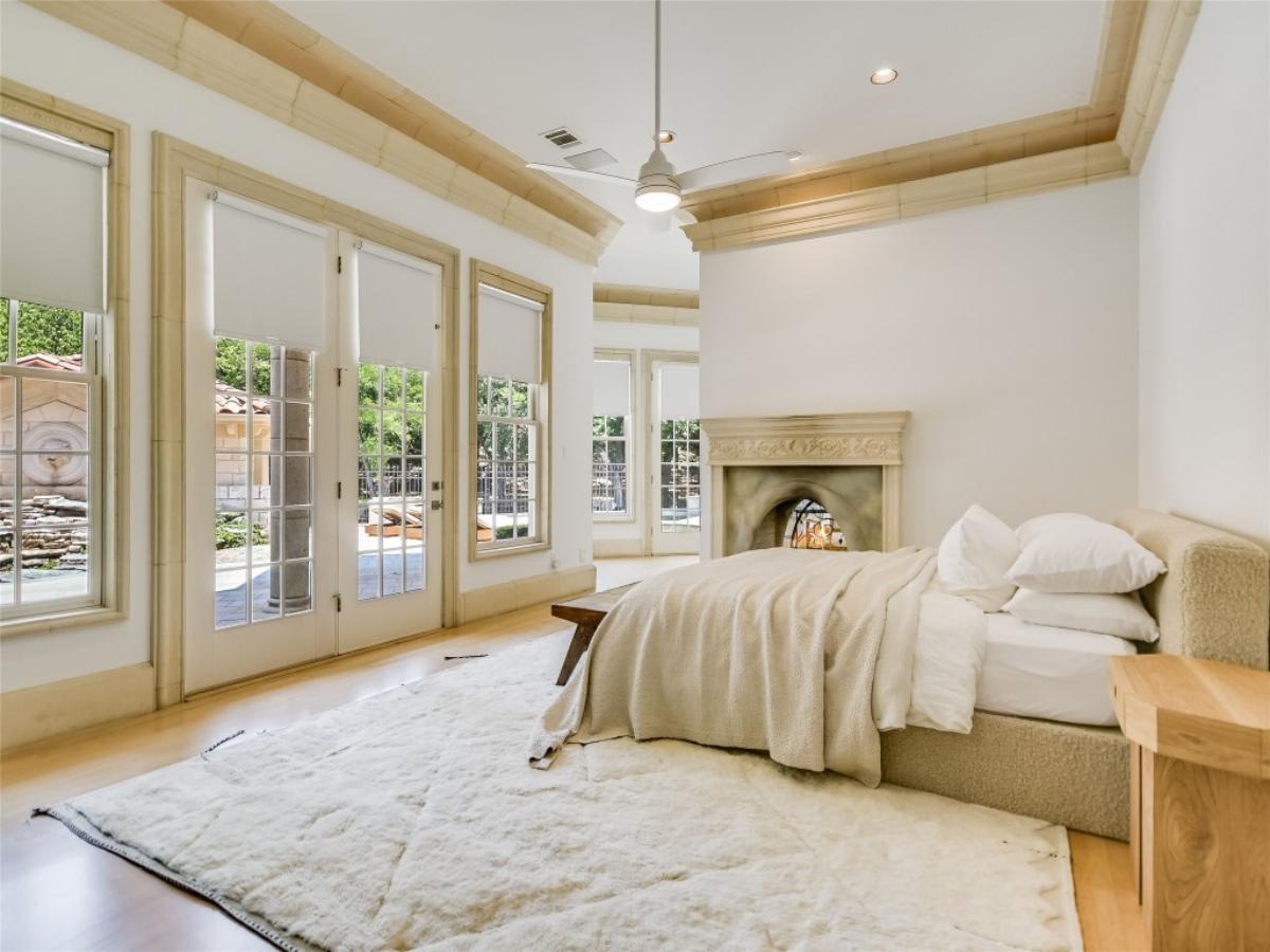 Bedroom with hardwood flooring and glass doors.