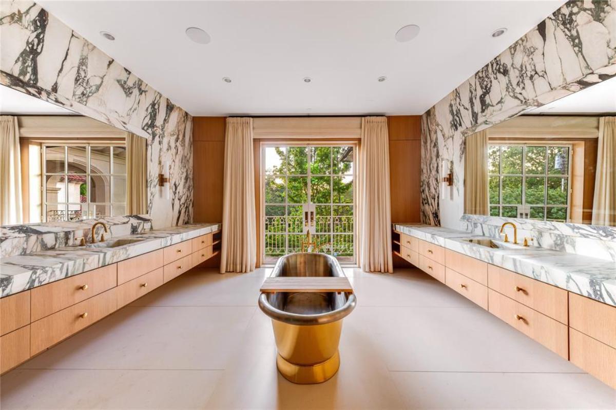 Bathroom with a custom-made vanity and a soaking tub.