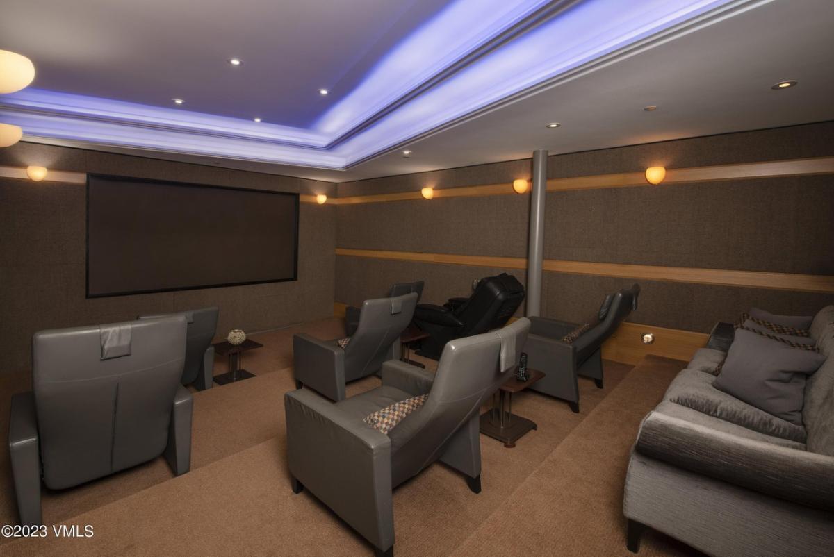 Home theater with reclining chairs.