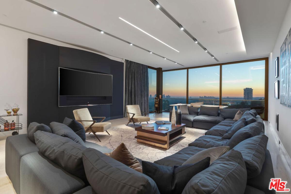 Family room with couches and a TV.