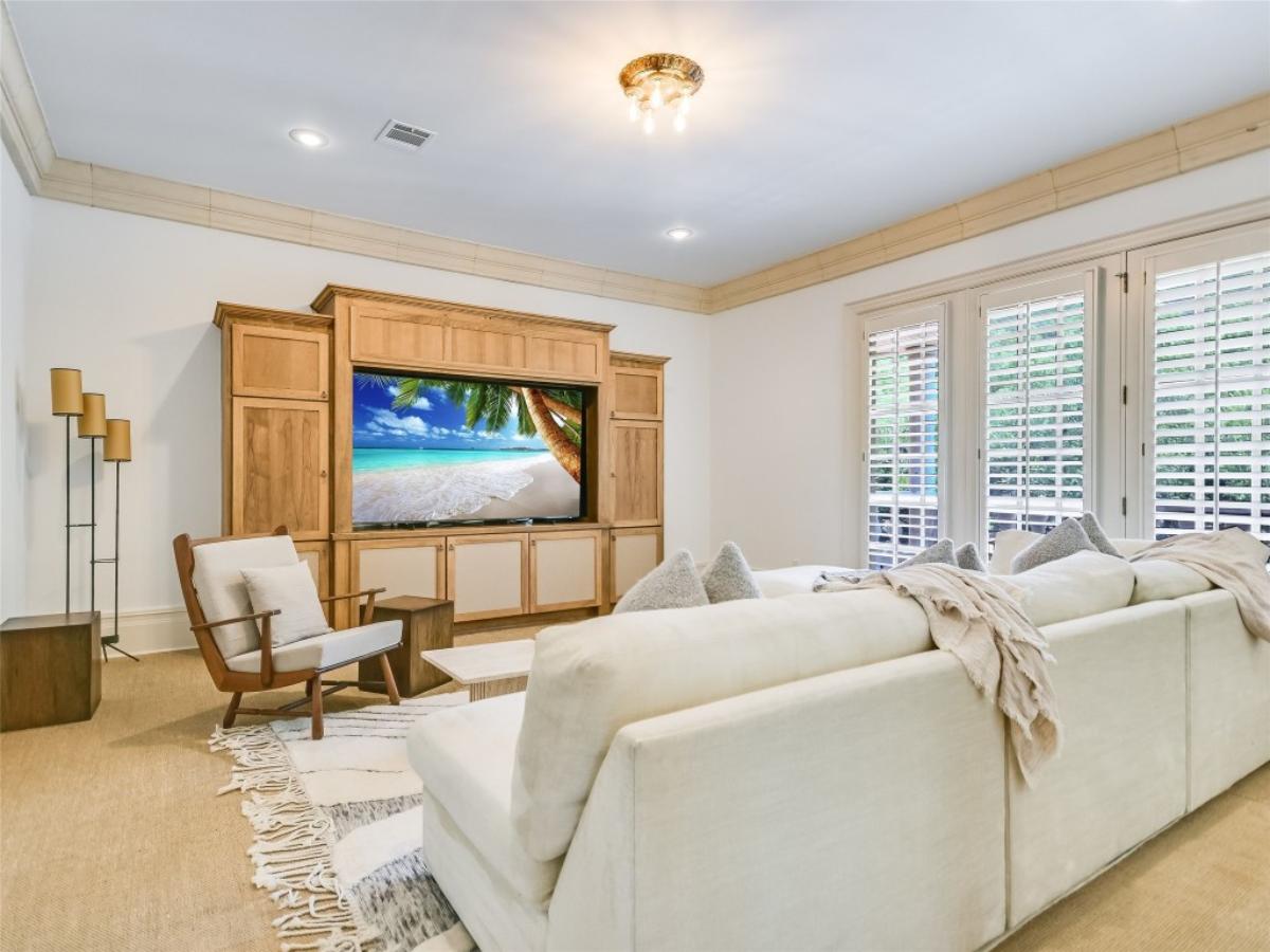 Family room with couches and a TV.