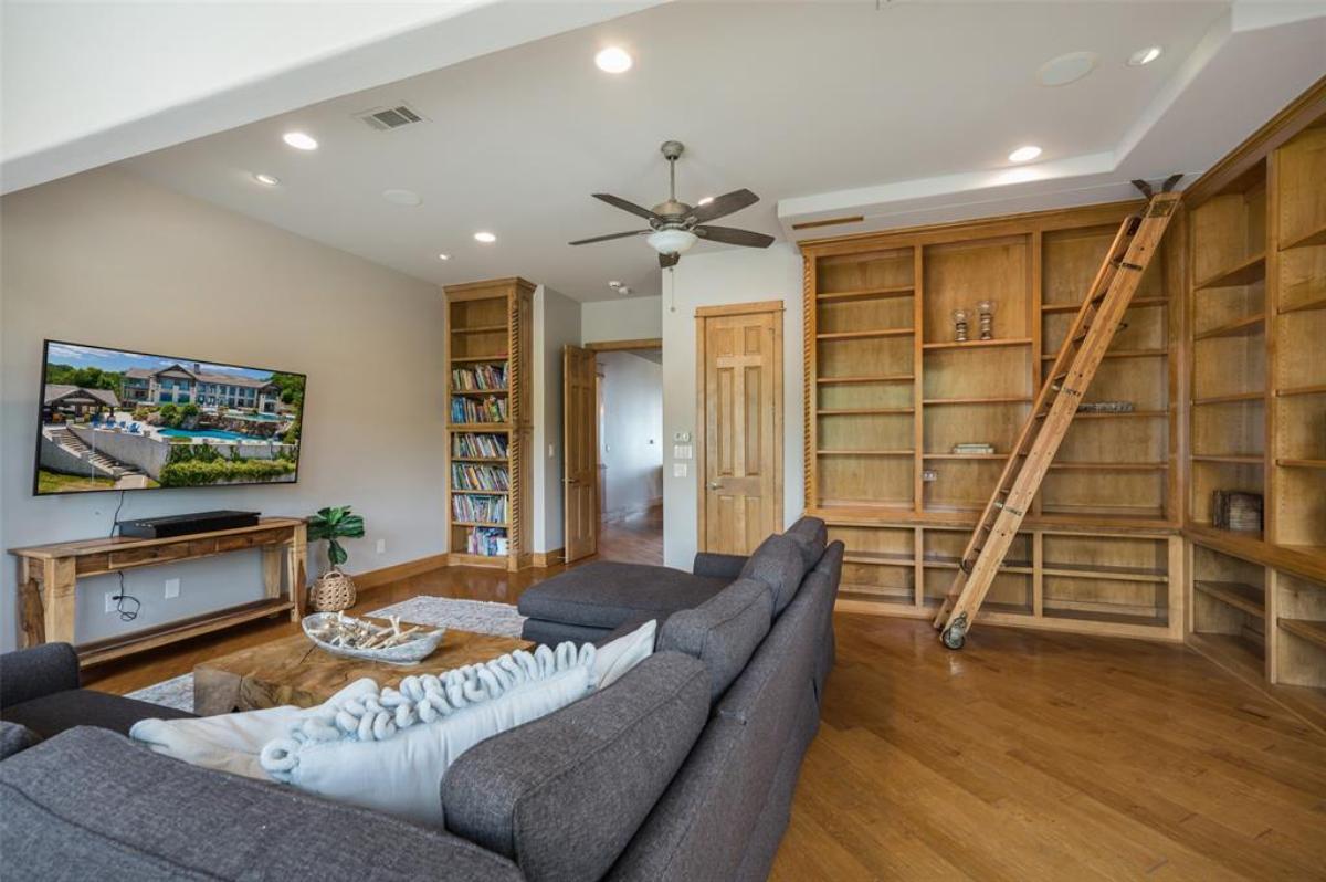 Family room with a couch and a TV