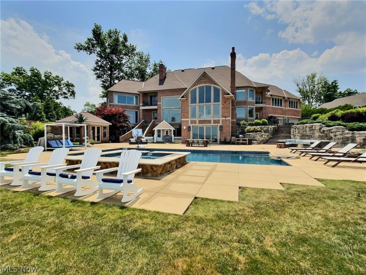 Rear view of the mansion with a pool.