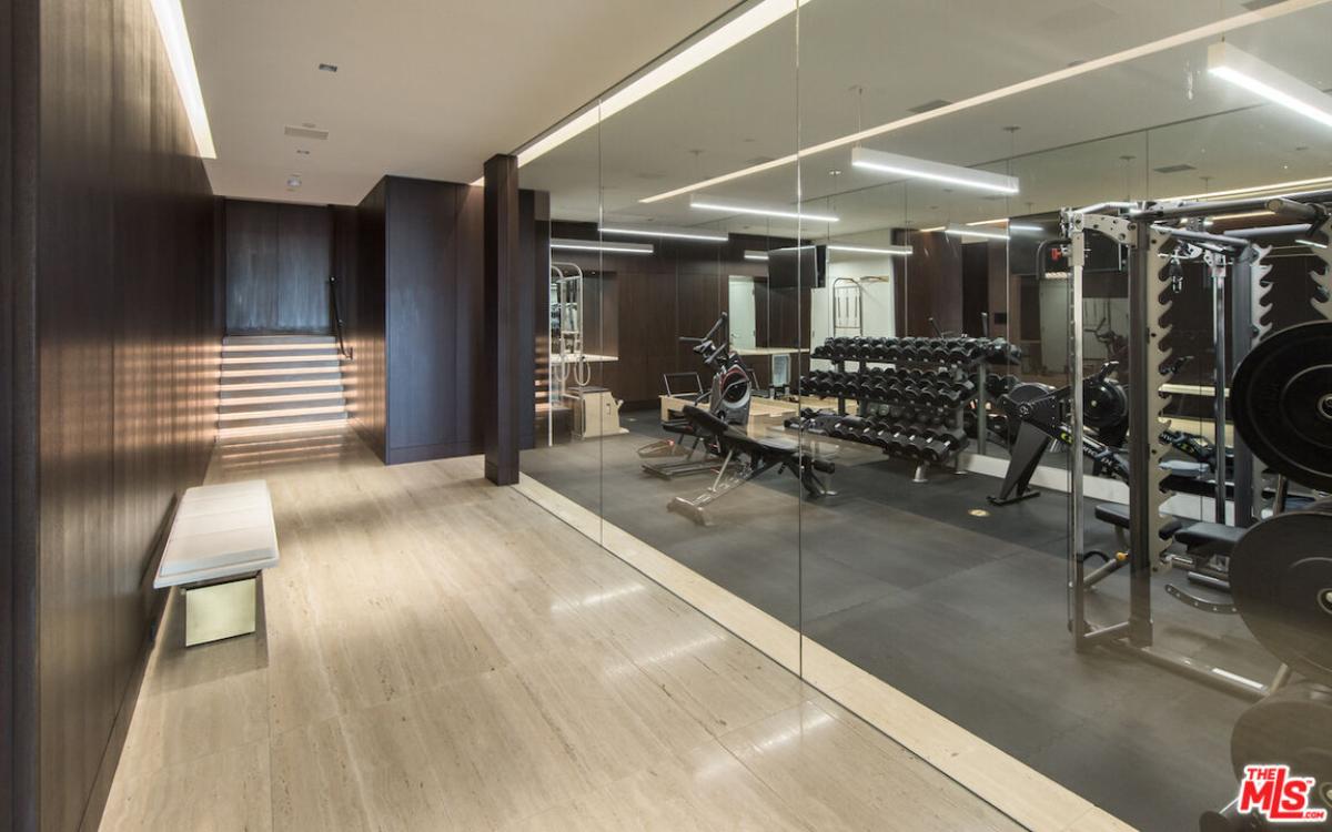 Home gym with glass walls.