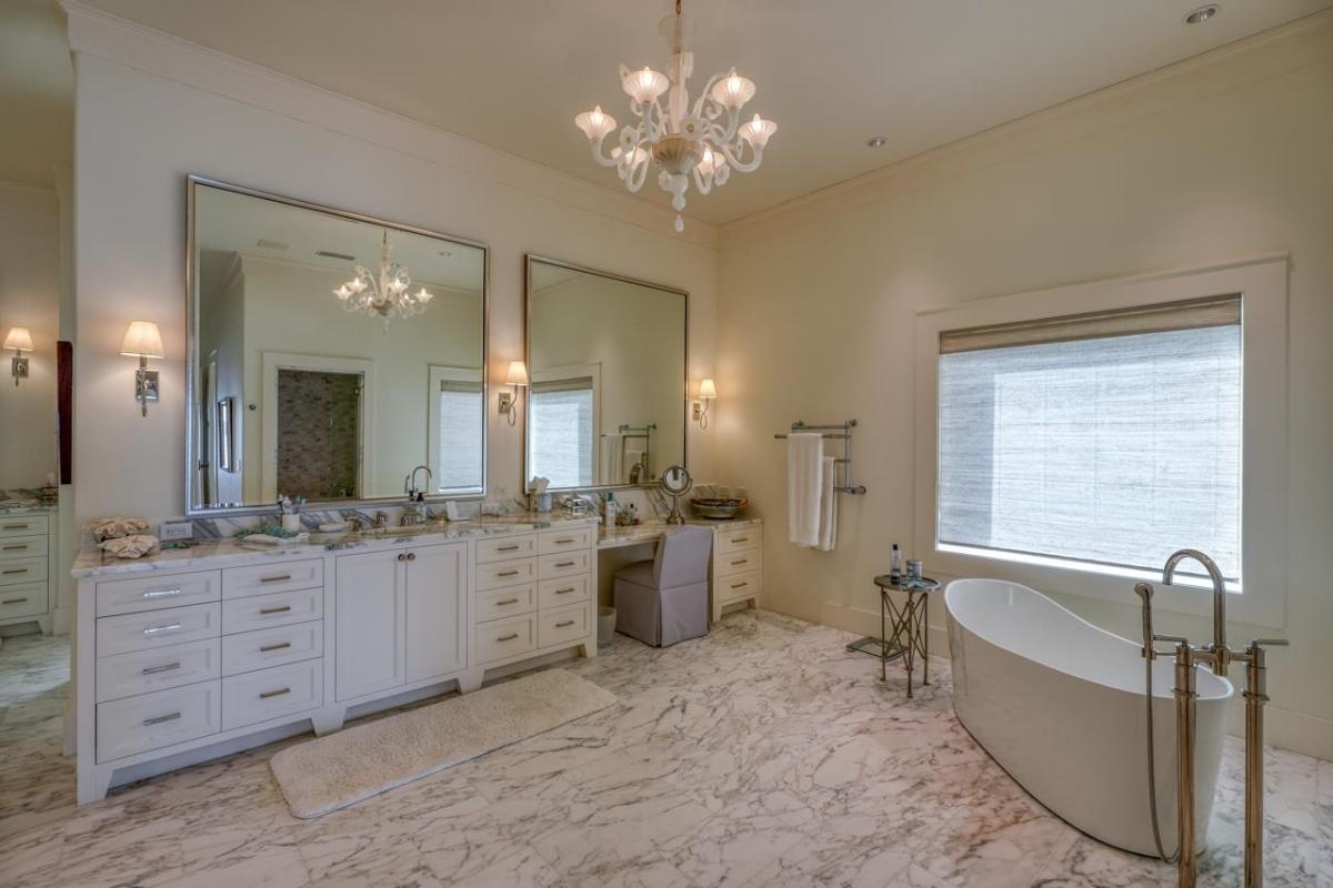 Bathroom with a custom-made vanity and a soaking tub.