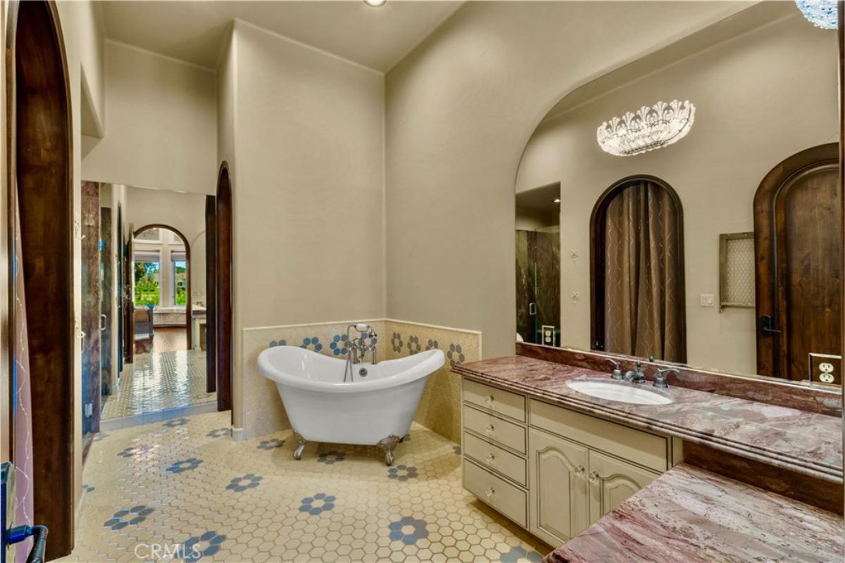 Bathroom with a soaking tub and a sink.