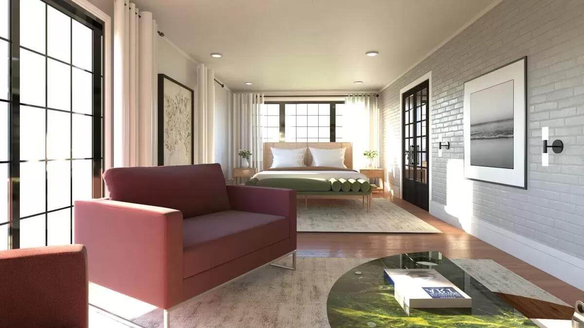 Bedroom with a wooden bed and a sitting area over distressed rugs.