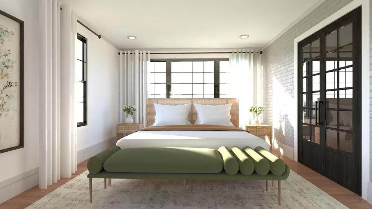 Bedroom with a cushioned bench and a wooden bed flanked by matching nightstands.