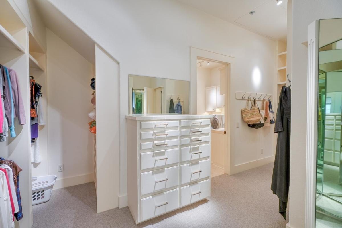 Walk-in closet with drawers.