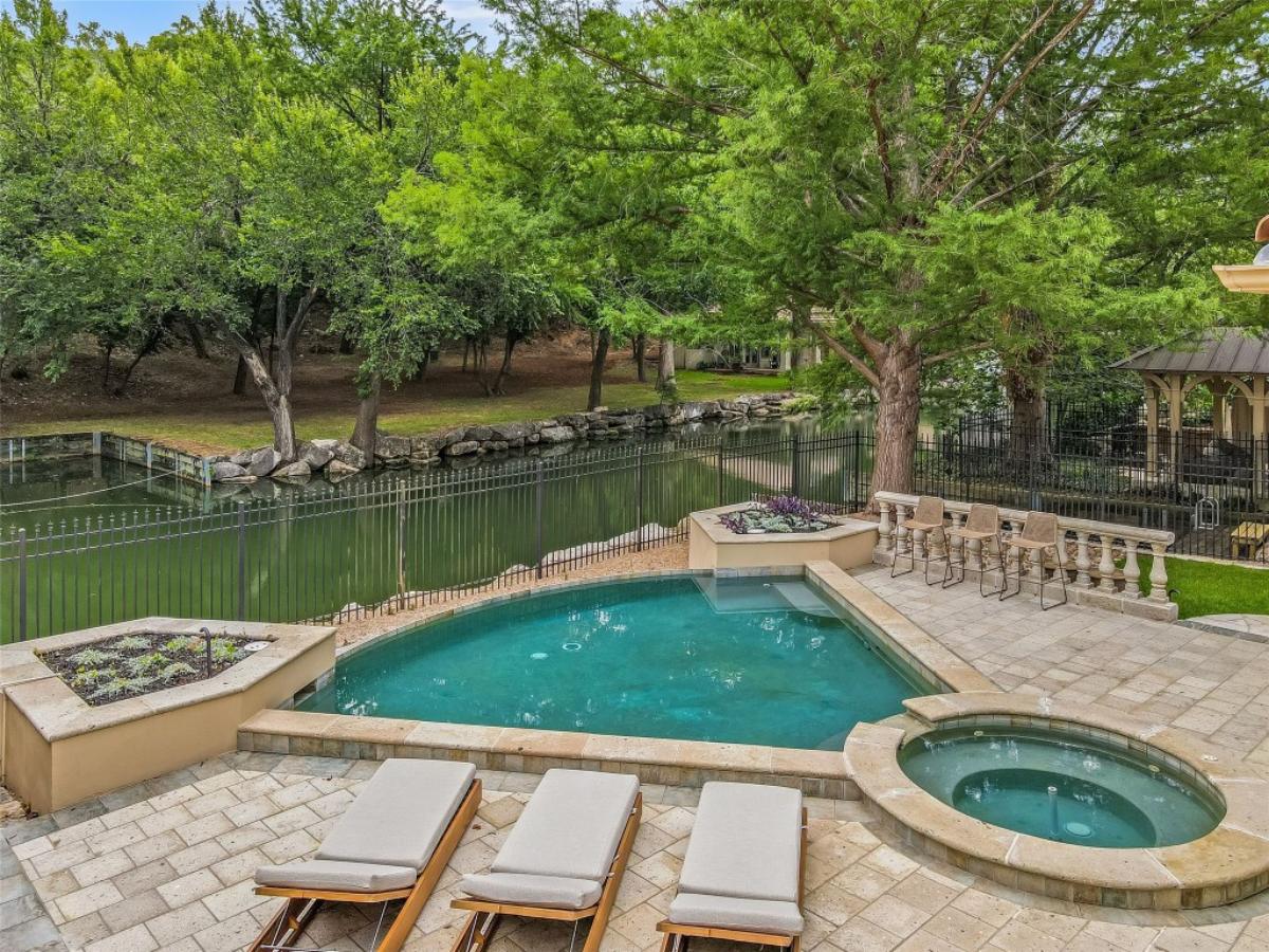 Pool with lounge chairs.