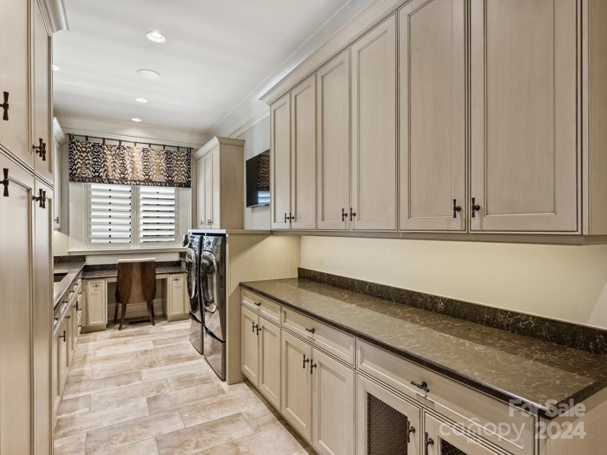 Laundry room with custom cabinetry.