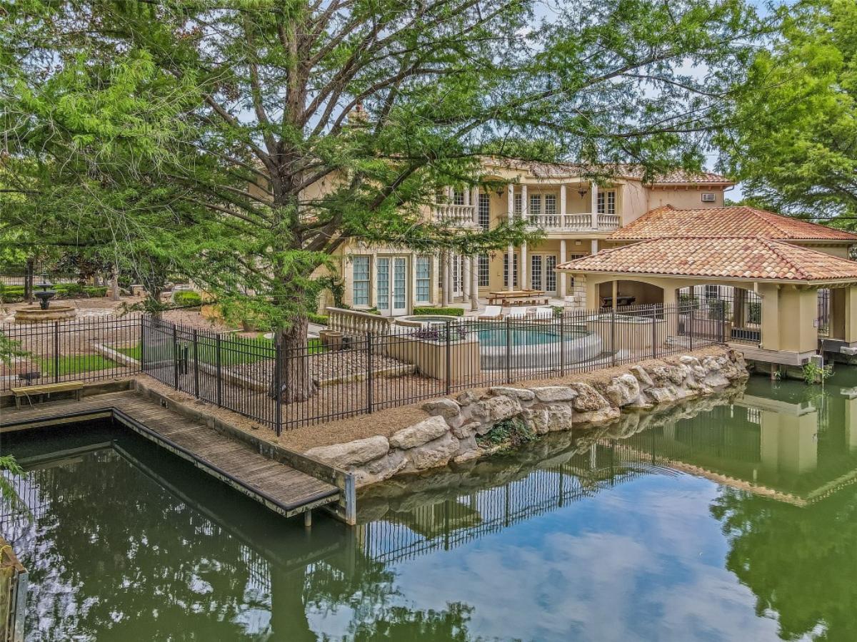 Rear view of the mansion with a pool.