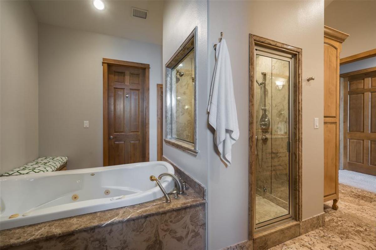 Bathroom with a soaking tub and a walk-in shower.