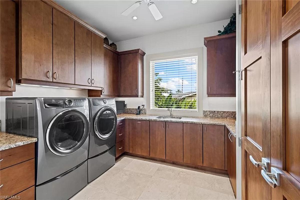 Laundry room with custom cabinetry.