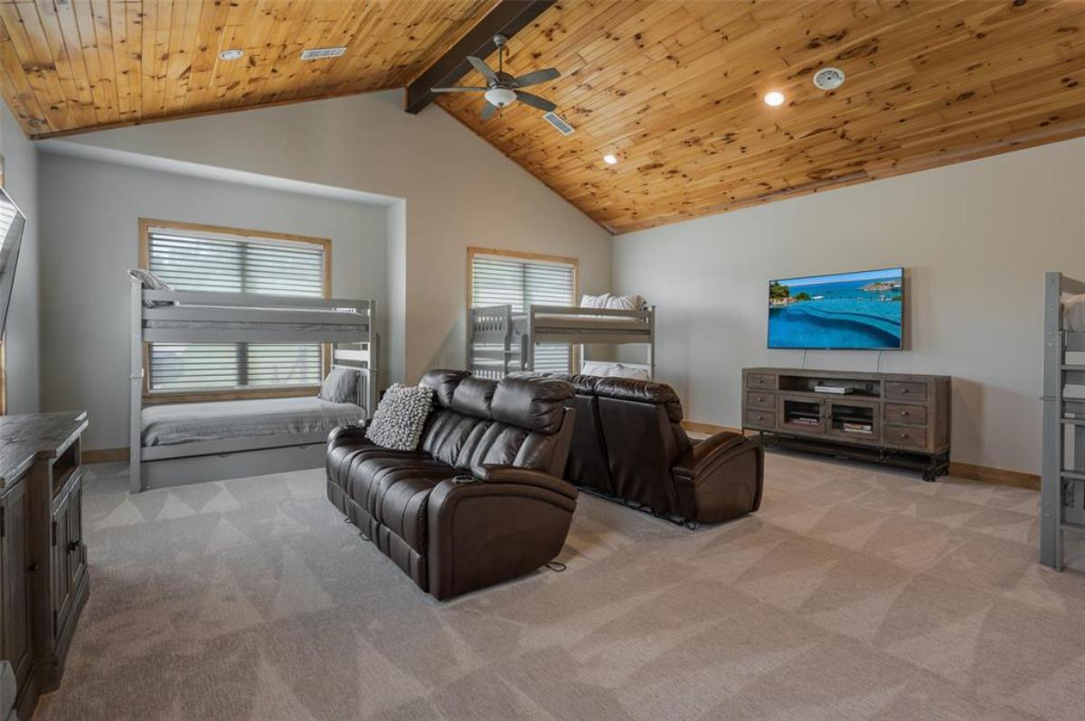 Bedroom with bunks and couches.