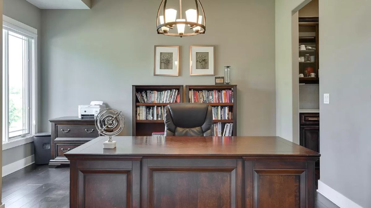 A home office with cabinet, shelf, desk, and chair