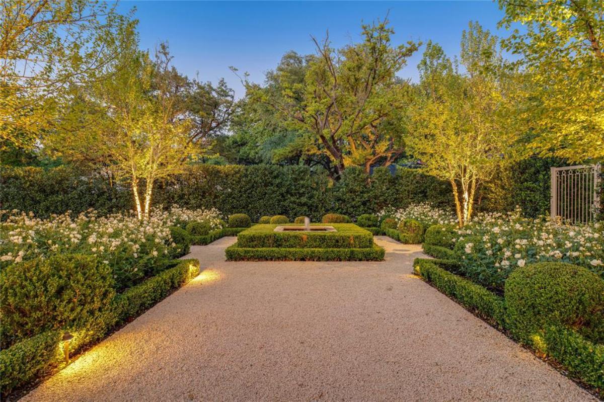 Garden with flowers and trees.