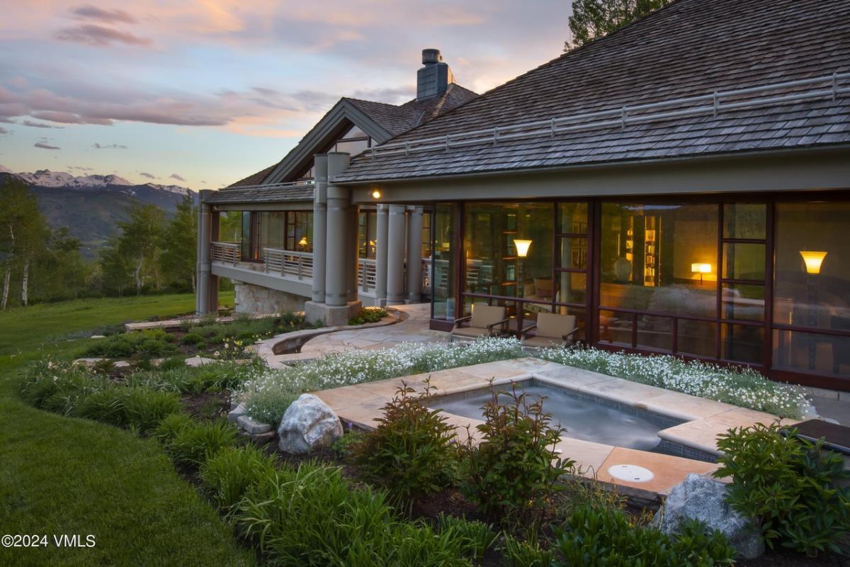 Backyard of the mansion with a garden.