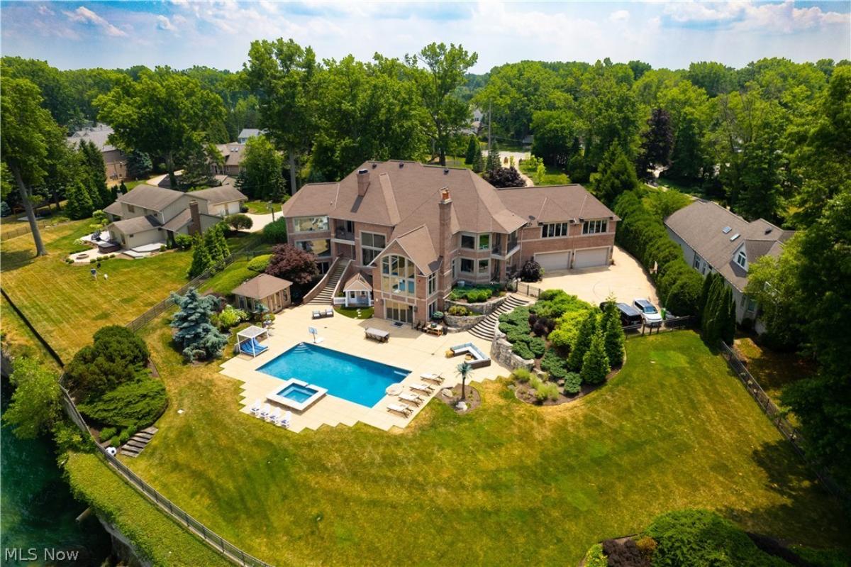 Aerial view of the mansion with a pool.