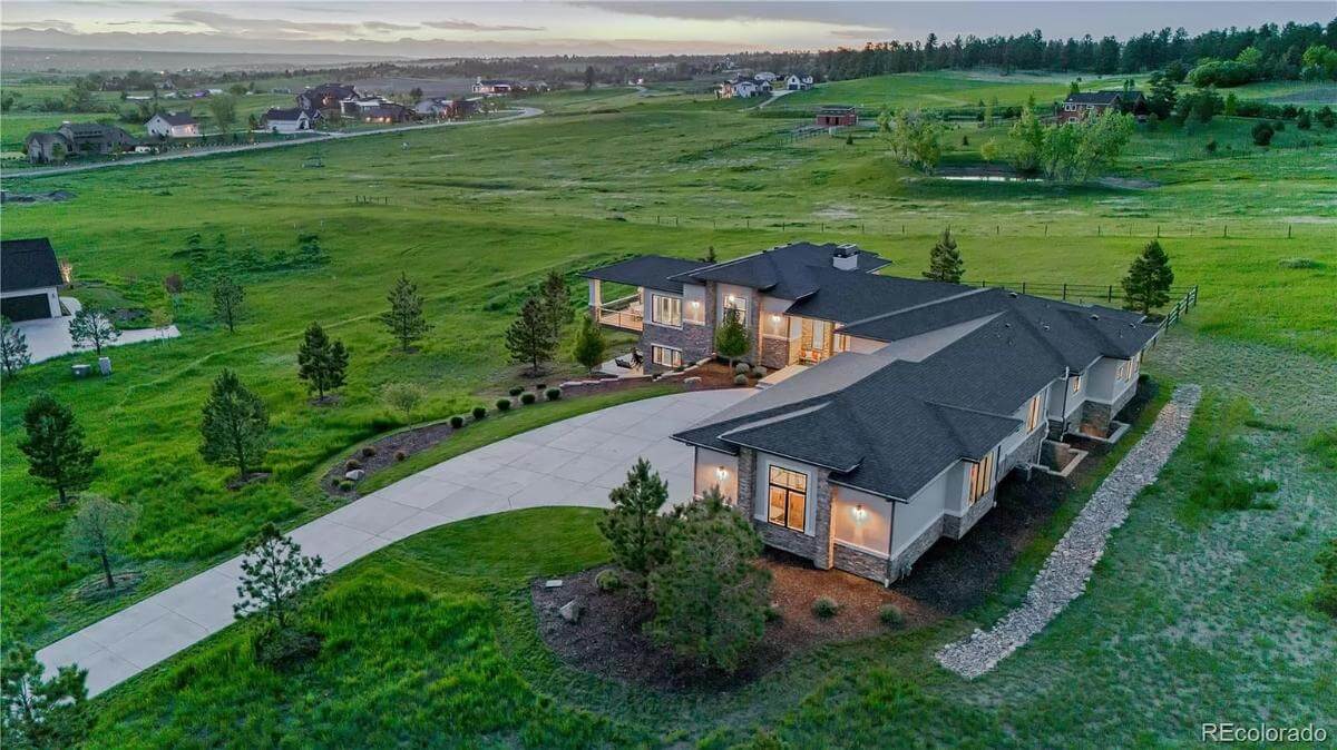 Aerial front view of the contemporary ranch.