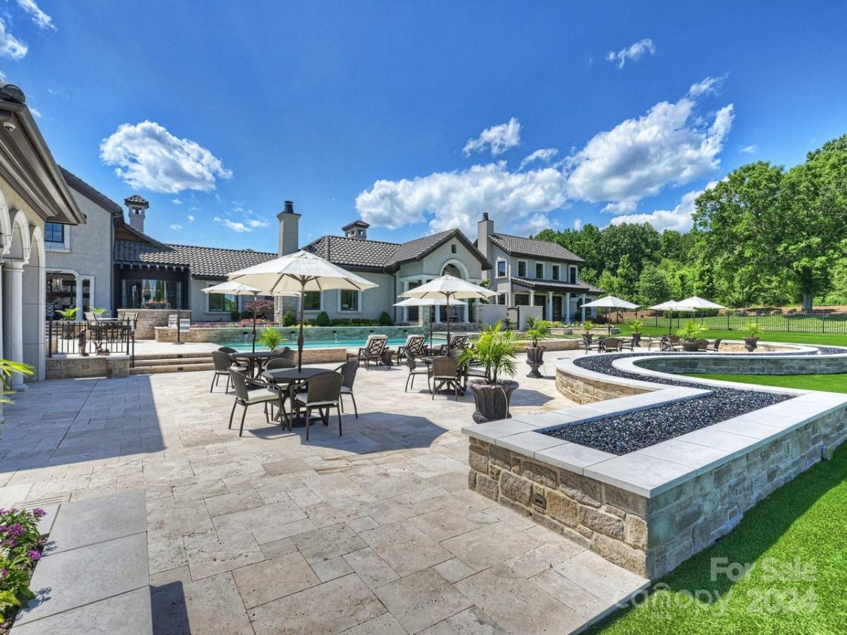 Pool with table and chairs.