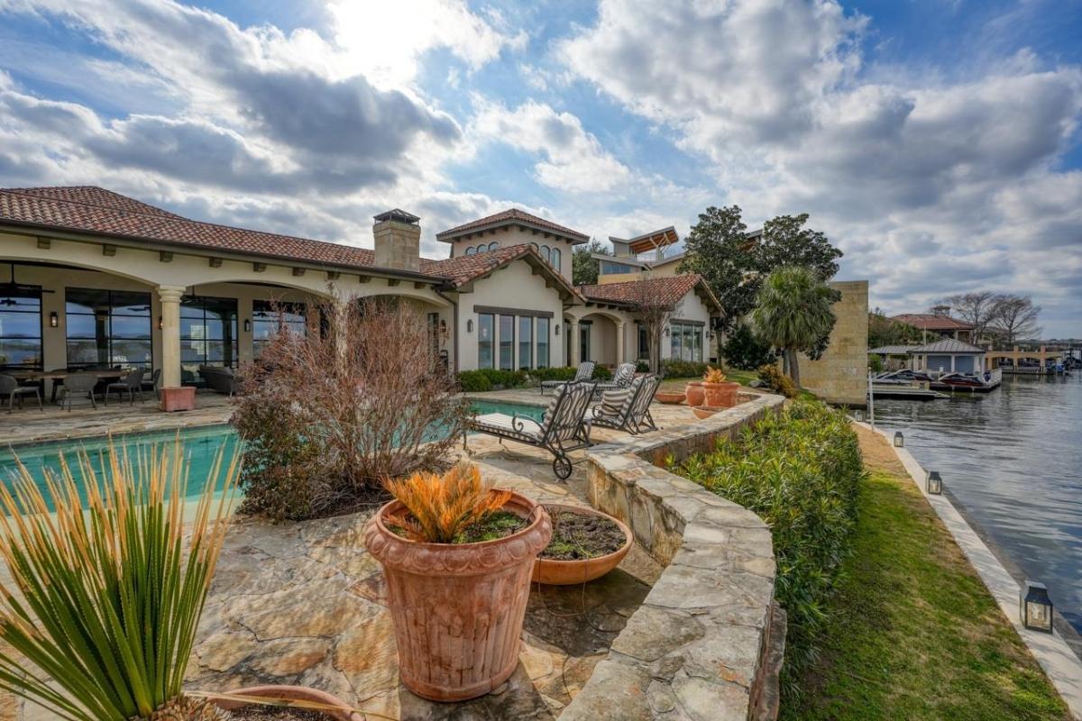 Rear view of the mansion with a pool.