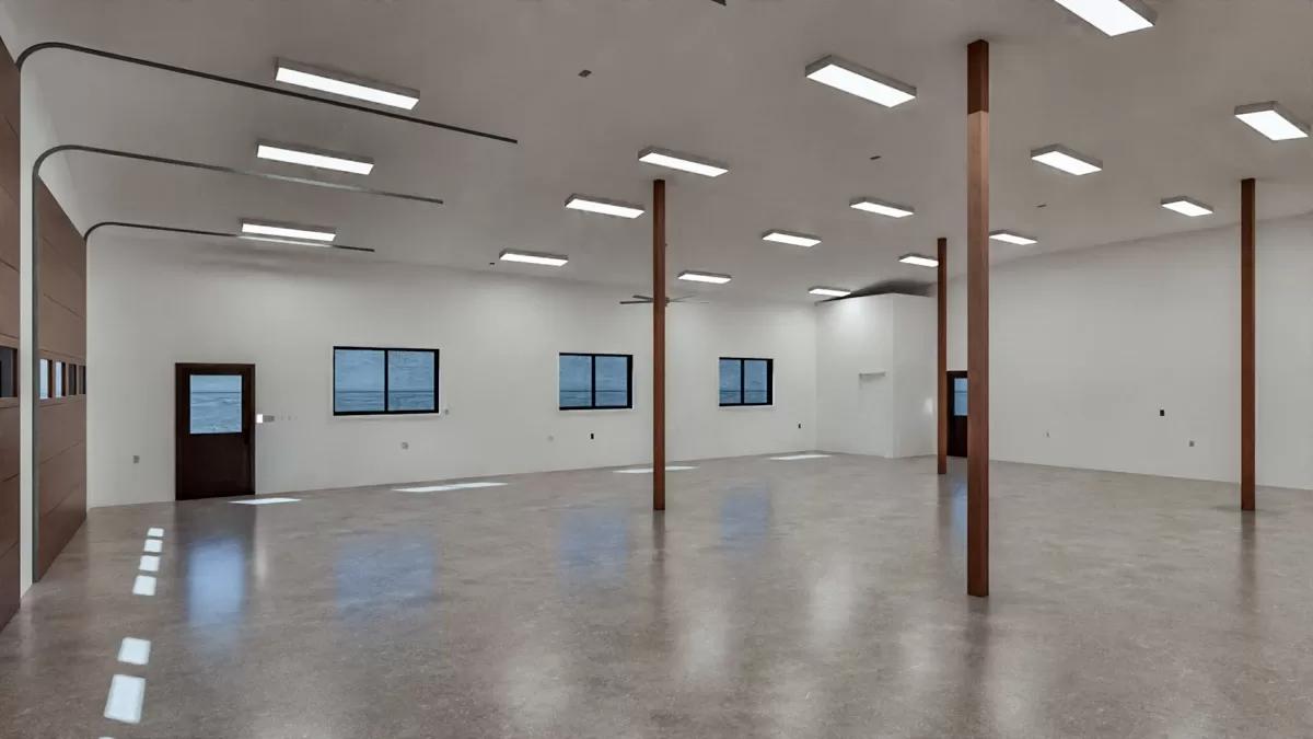 Garage with concrete flooring and timber posts.