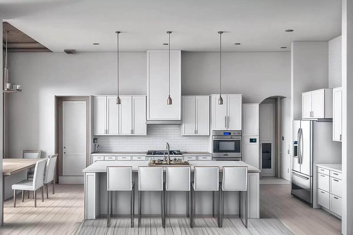 Kitchen with white cabinetry, premium appliances, and a breakfast island that seats five.