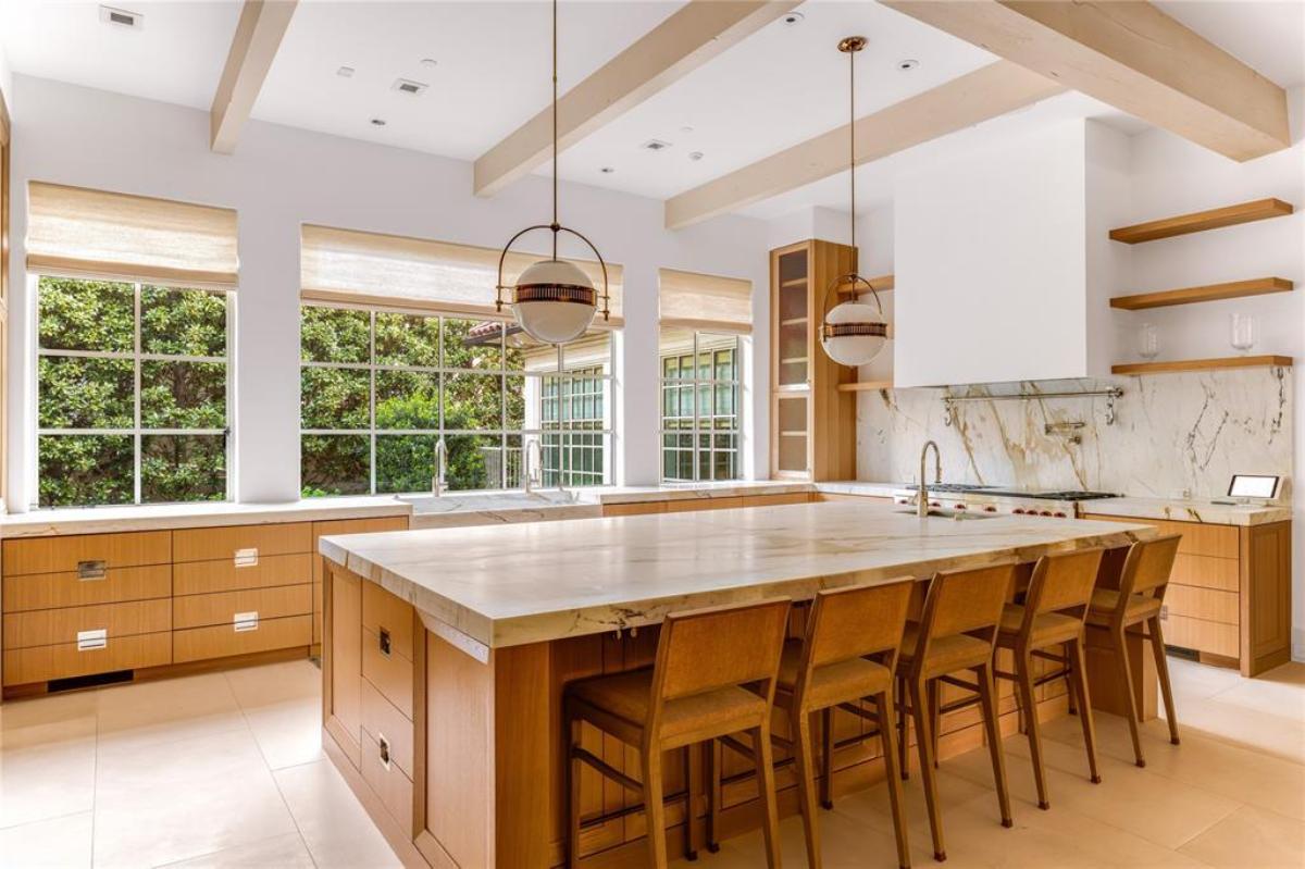 Kitchen with a spacious counter breakfast bar and a center island prep area.