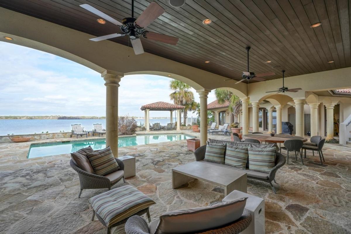 Outdoor living space overlooking the pool and the river.