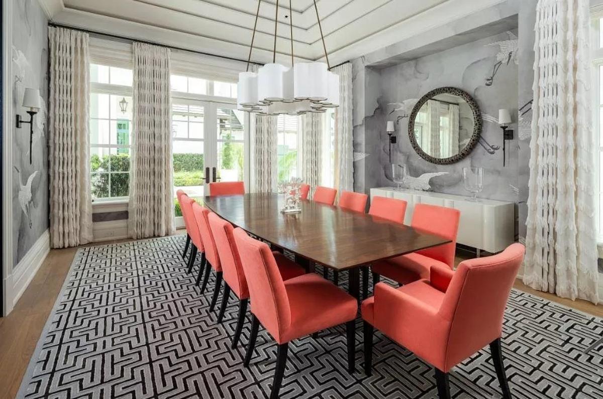 Dining room with a large wood table and chairs.