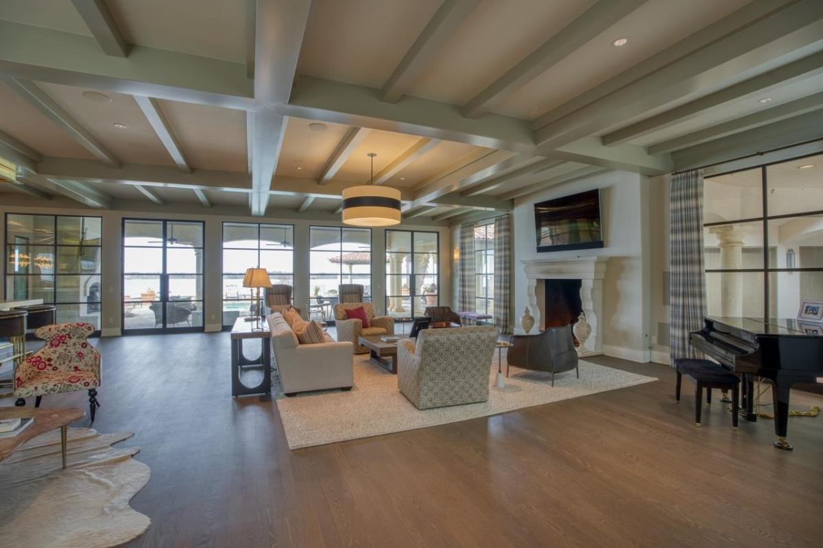 Living room with a hardwood flooring and a fireplace.