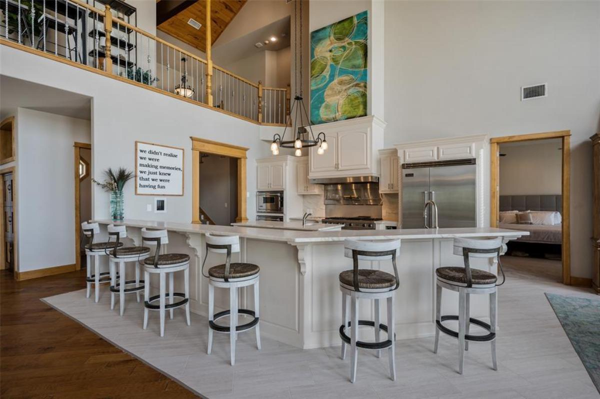 Kitchen with stainless-steel appliances and custom cabinetry.