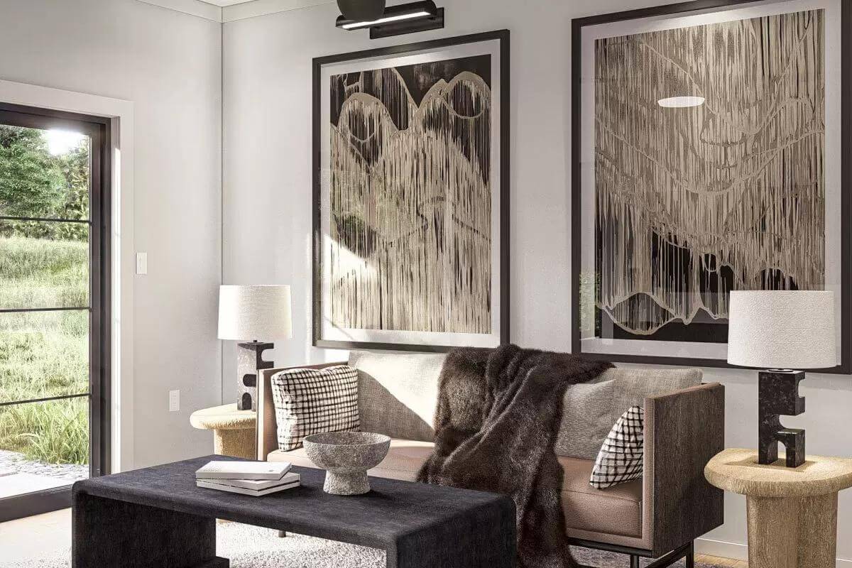 Family room with a brown sofa and a black coffee table topped by a decorative bowl.