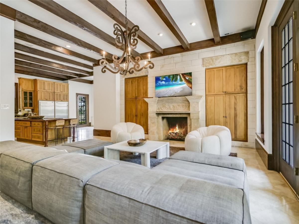 Living room with a coffered ceiling and a fireplace.