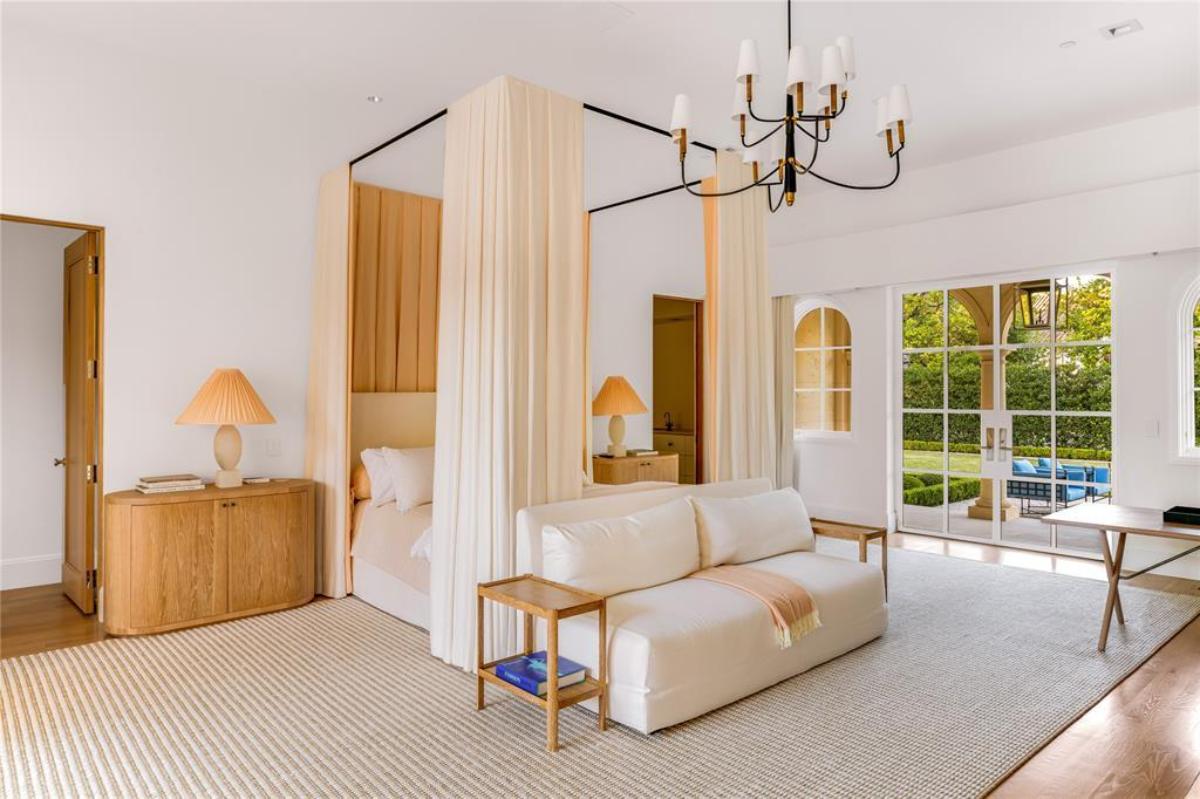 Bedroom with a large bed and glass doors.