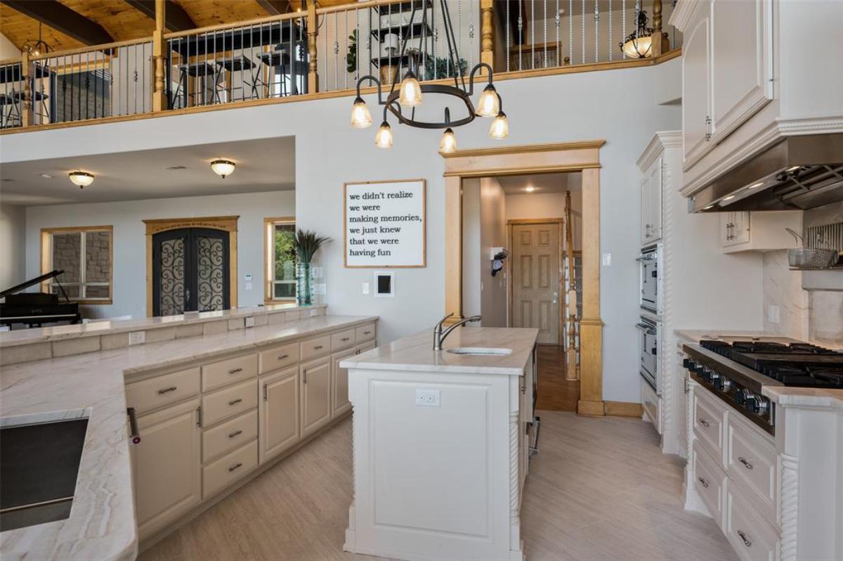 Kitchen with stainless-steel appliances and custom cabinetry.