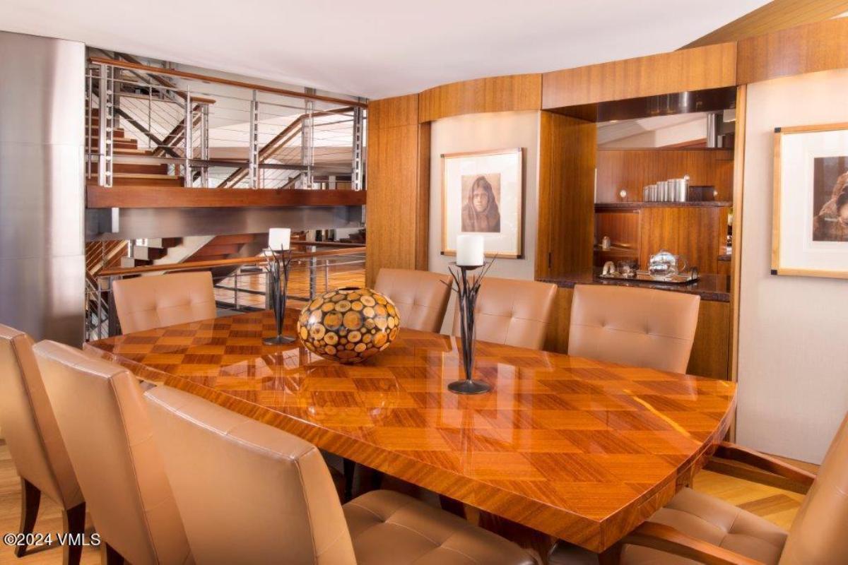 Dining room with a large wood table.