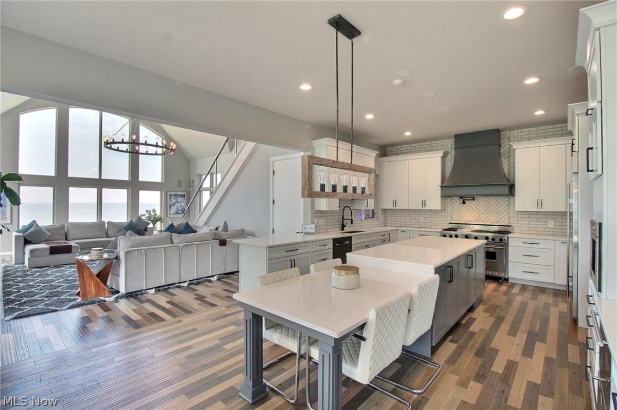 Kitchen with stainless-steel appliances, a nook and a center island prep area.