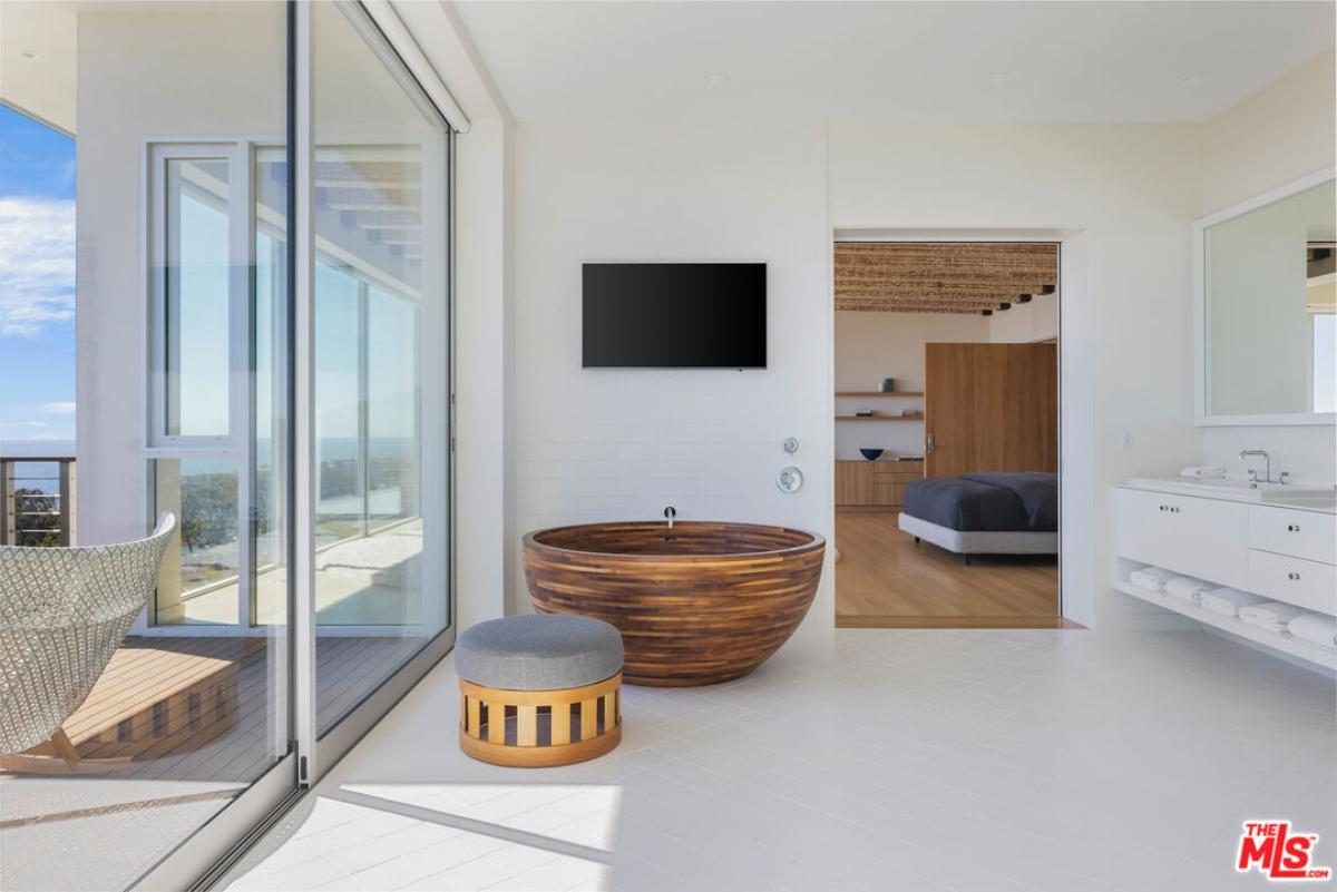 Bathroom with a sink and sliding doors.