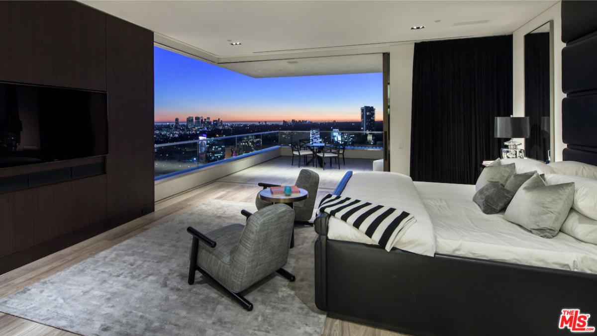 Bedroom with a balcony.