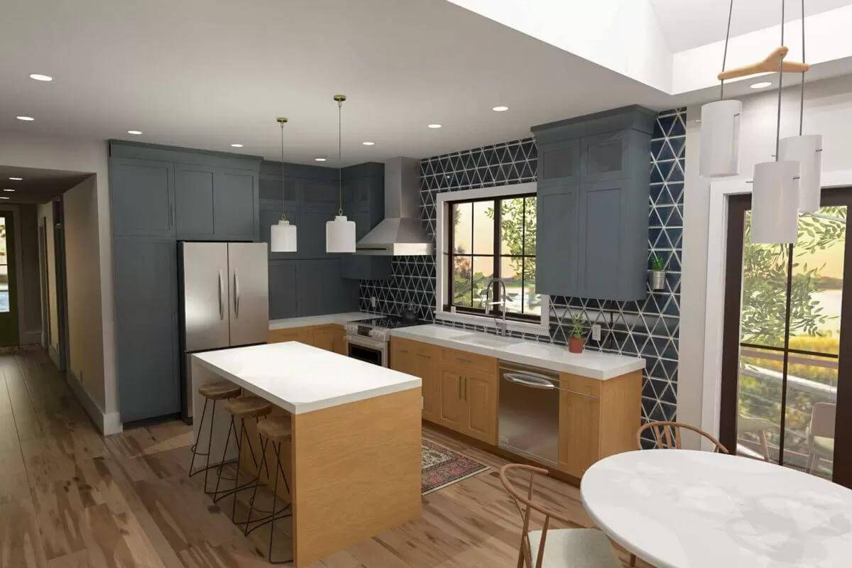 Kitchen and dining area illuminated by white pendants and recessed ceiling lights.