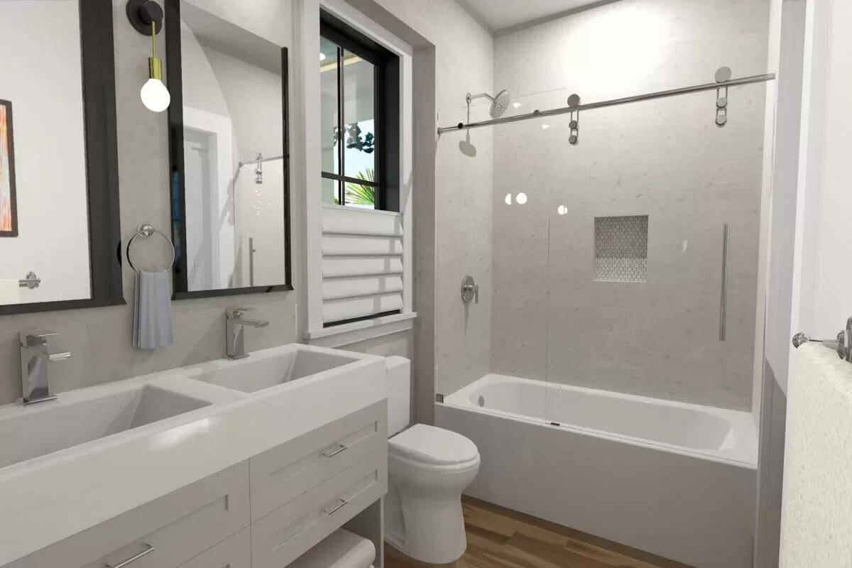 Bathroom with a dual sink vanity and a tub and shower combo.