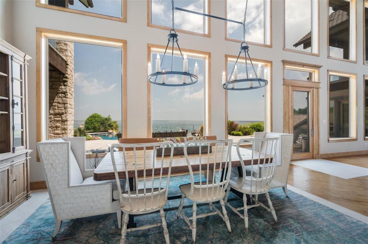 Dining room with wood tables and glass windows.