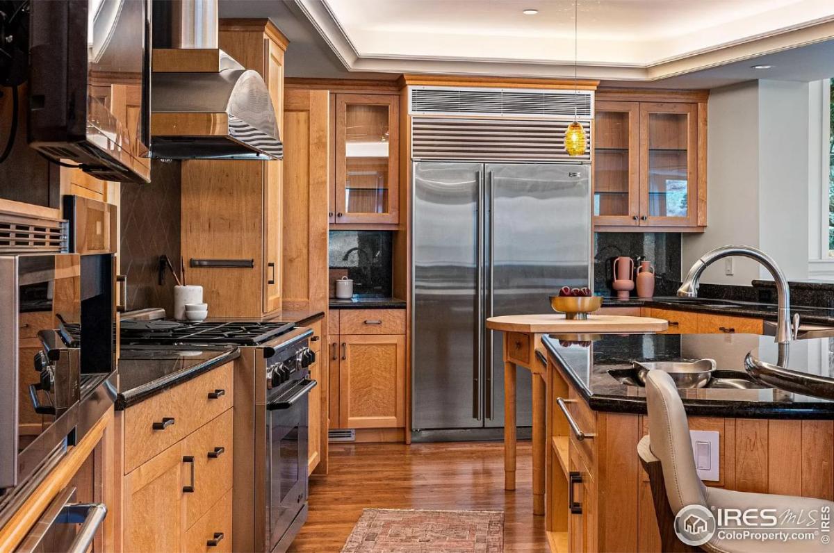 Kitchen with stainless-steel appliances and a center island prep area.