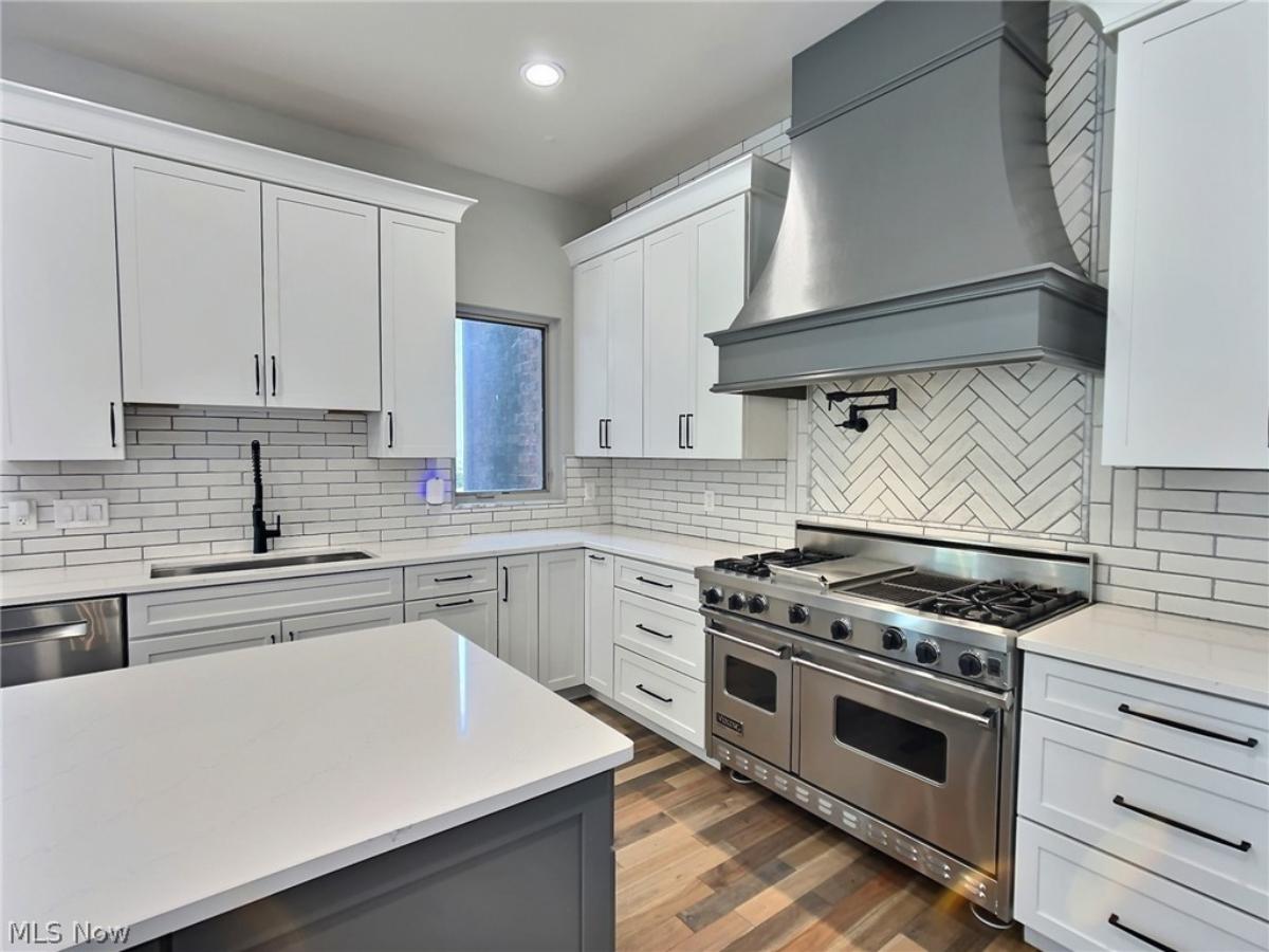 Kitchen with stainless-steel appliances and a center island prep area.