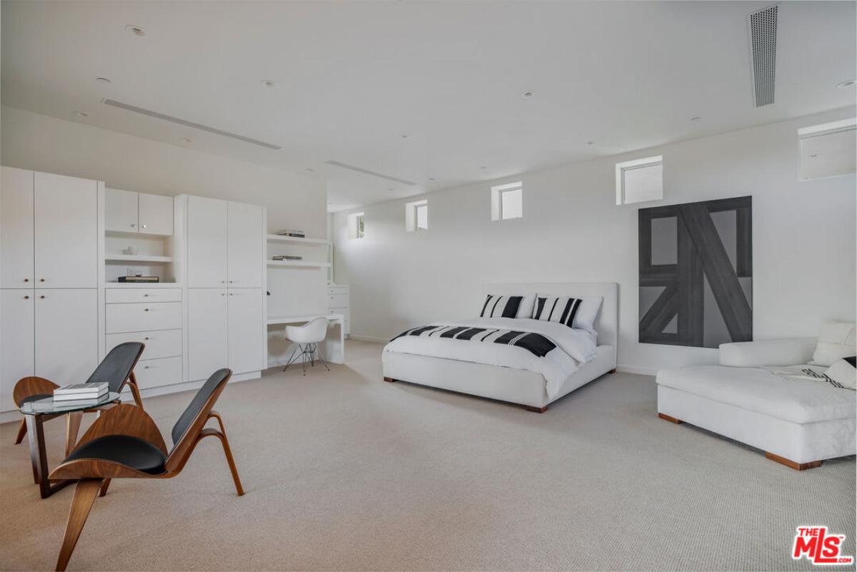 Bedroom with carpet flooring and a closet.