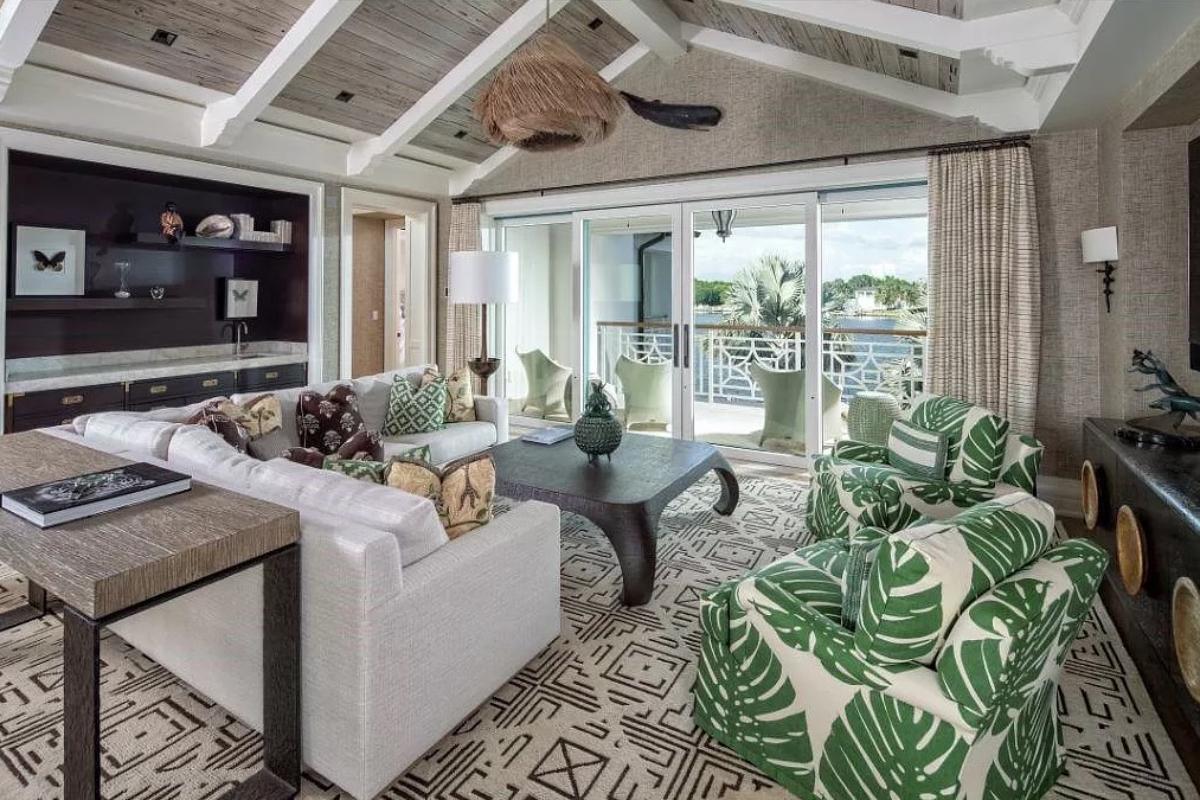 Living room with a sliding glass door, carpet flooring and Cathedral ceiling.